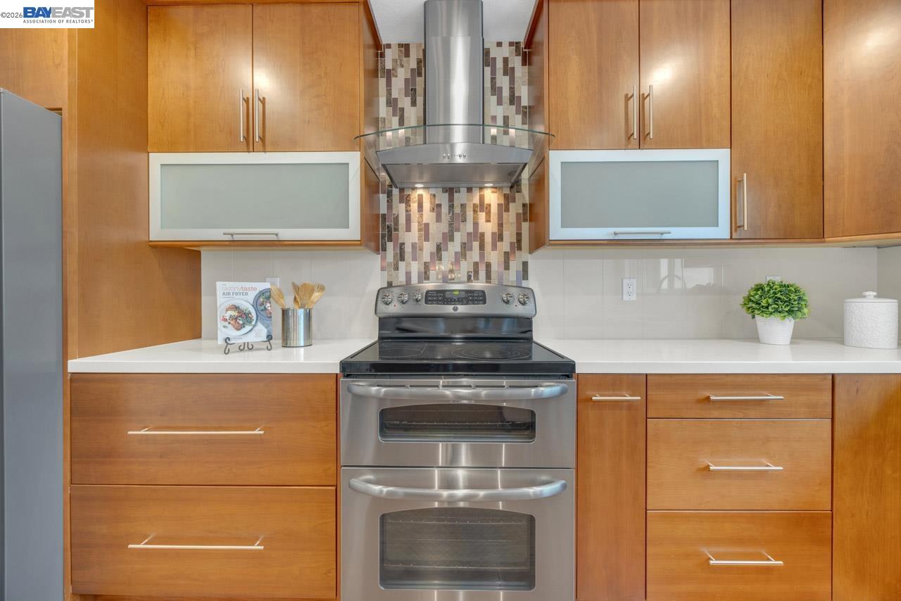 4034 Rennellwood Way Pleasanton, CA 94566 - Photo 25 of 42 a kitchen with a stove and cabinets