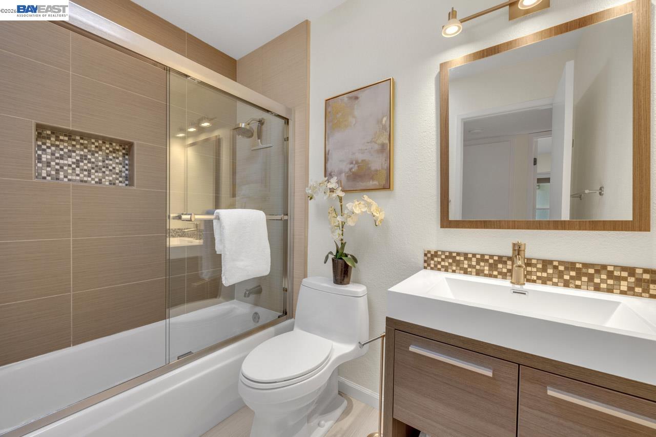 4034 Rennellwood Way Pleasanton, CA 94566 - Photo 29 of 42 a bathroom with a sink toilet and shower