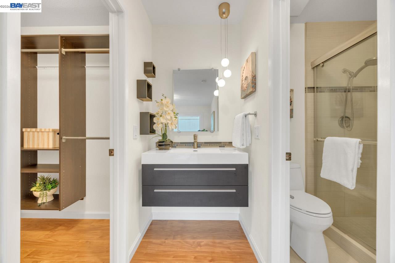4034 Rennellwood Way Pleasanton, CA 94566 - Photo 36 of 42 a bathroom with a sink a toilet and shower