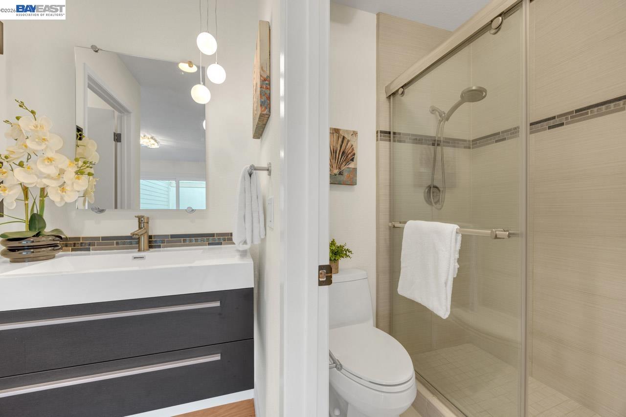 4034 Rennellwood Way Pleasanton, CA 94566 - Photo 37 of 42 a bathroom with a sink a toilet and shower