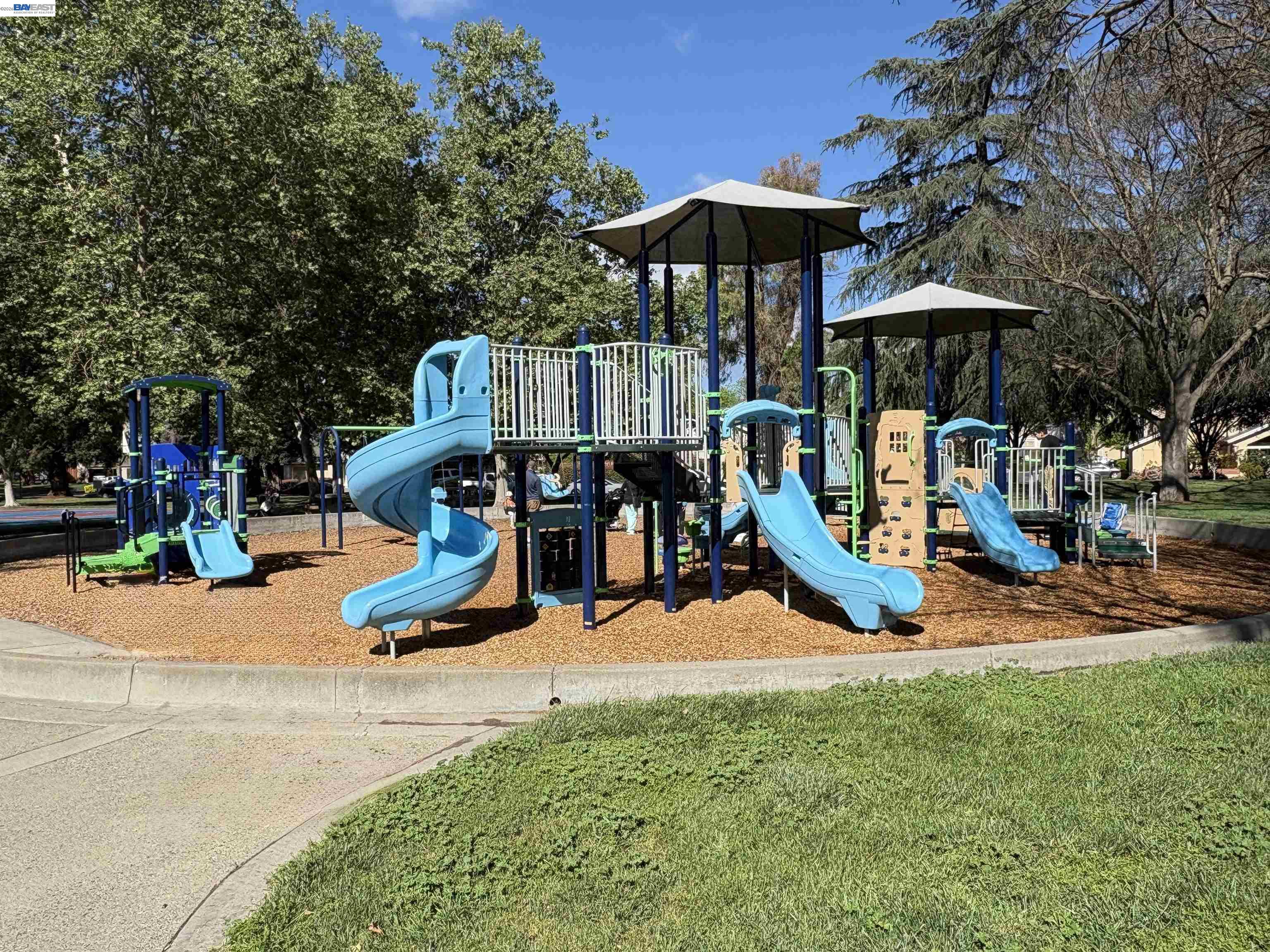 4034 Rennellwood Way Pleasanton, CA 94566 - Photo 42 of 42 a view of a park with swings and slides
