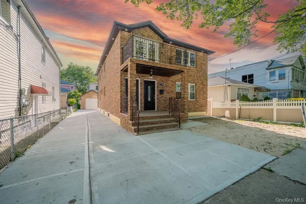 a view of a house with a street