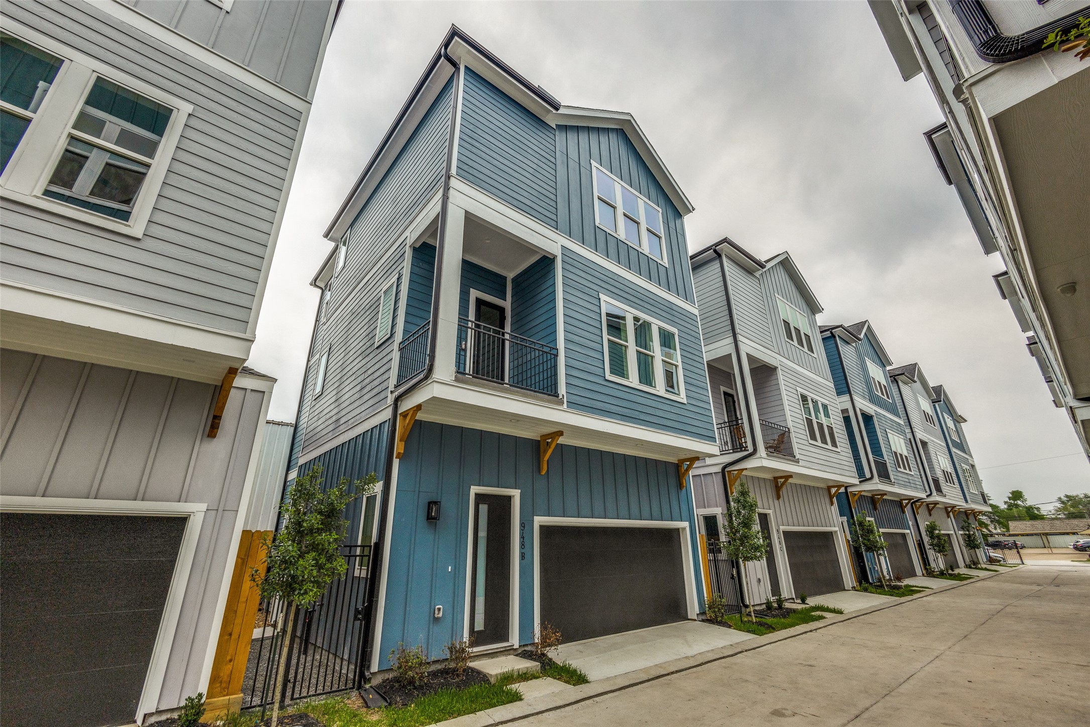 948 Fisher Street, Unit B Houston, TX 77018 - Photo 1 of 25 a front view of a house with a garage