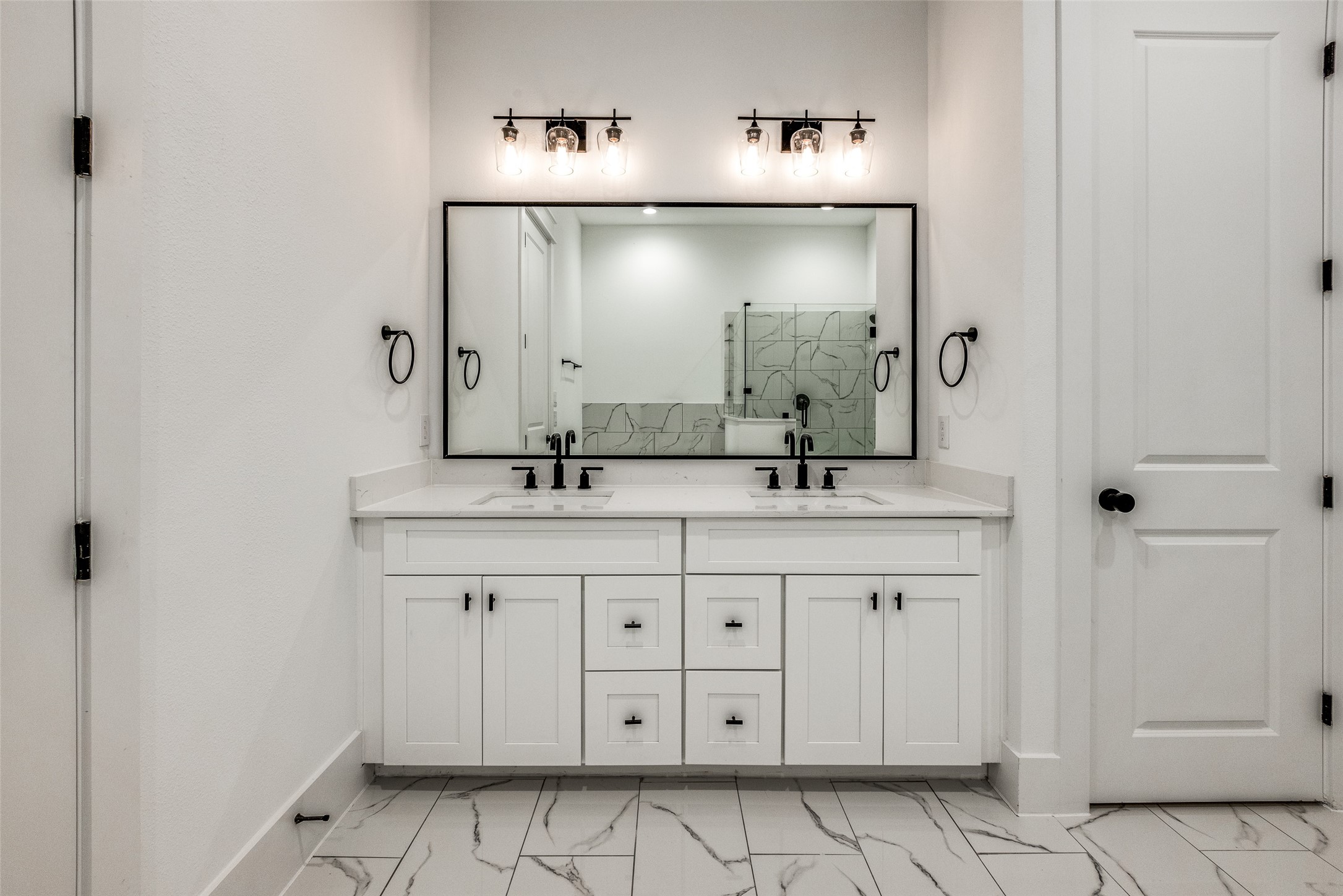 948 Fisher Street, Unit B Houston, TX 77018 - Photo 17 of 25 a bathroom with a double vanity sink and a mirror