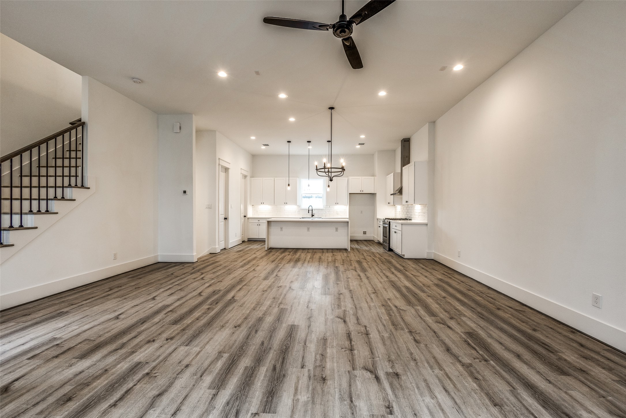 948 Fisher Street, Unit B Houston, TX 77018 - Photo 4 of 25 a view of a kitchen with a dishwasher and wooden floor
