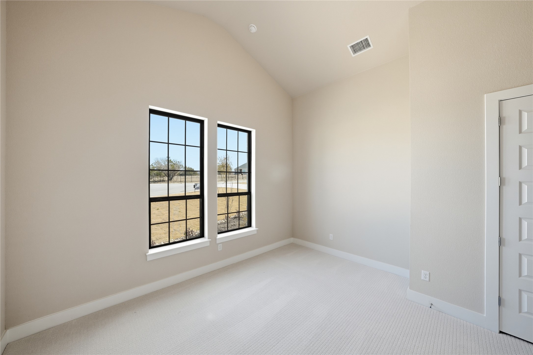 1209 Doelling Drive Georgetown, TX 78633 - Photo 19 of 31 Carpeted empty room with baseboards and vaulted ceiling