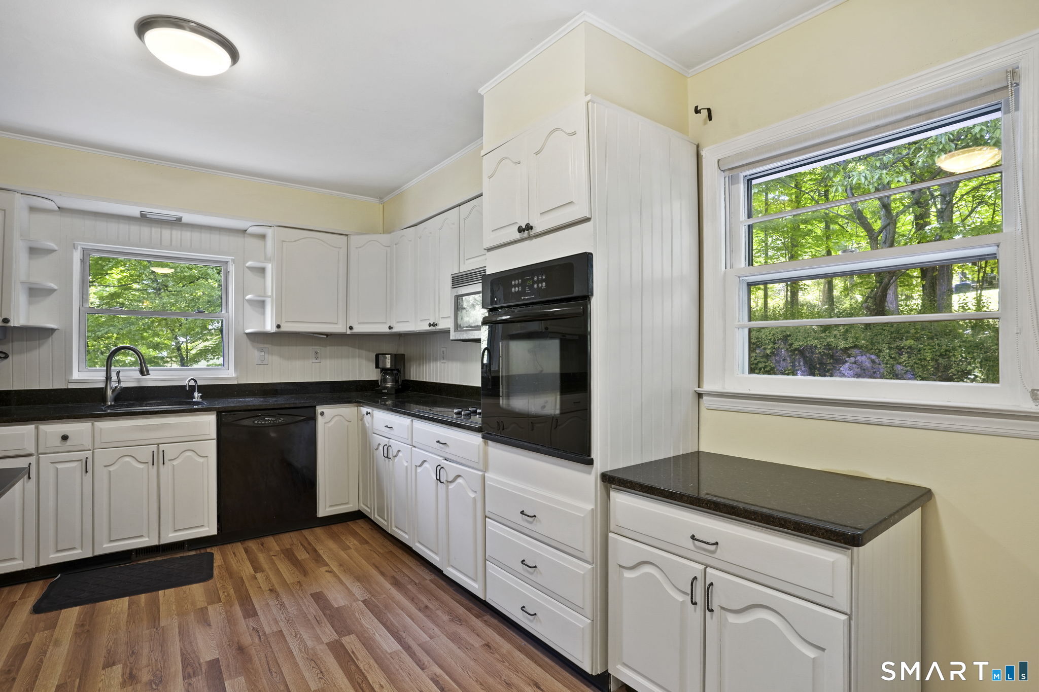 2 Laurel Hill Road South Sherman, CT 06784 - Photo 12 of 35 a kitchen with granite countertop white cabinets white appliances a sink and a large window