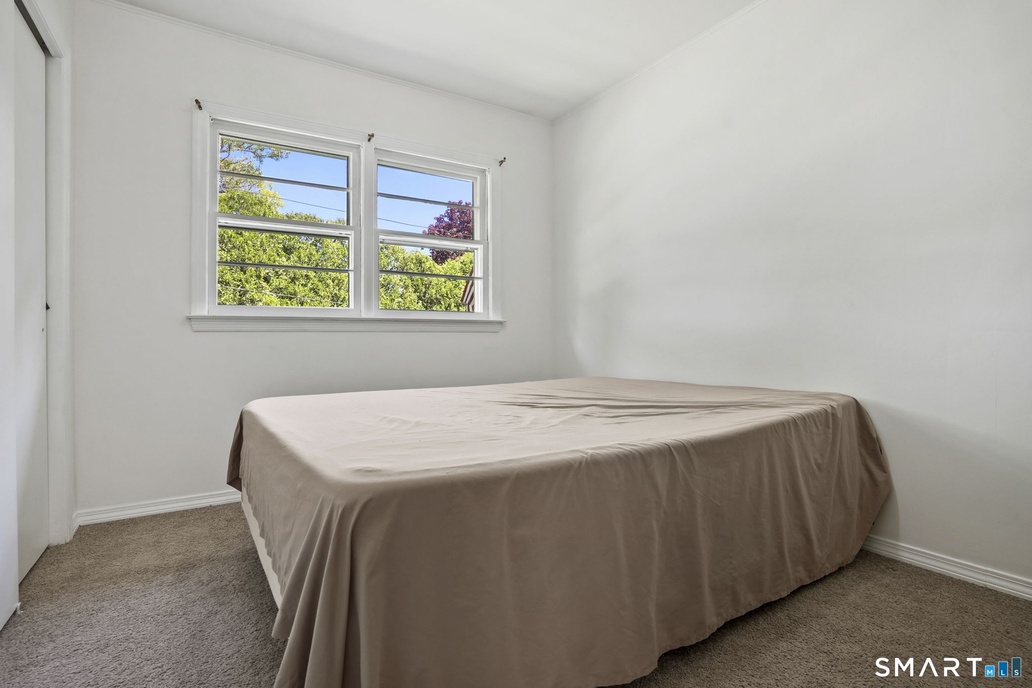 2 Laurel Hill Road South Sherman, CT 06784 - Photo 19 of 35 a bedroom with a bed and a window