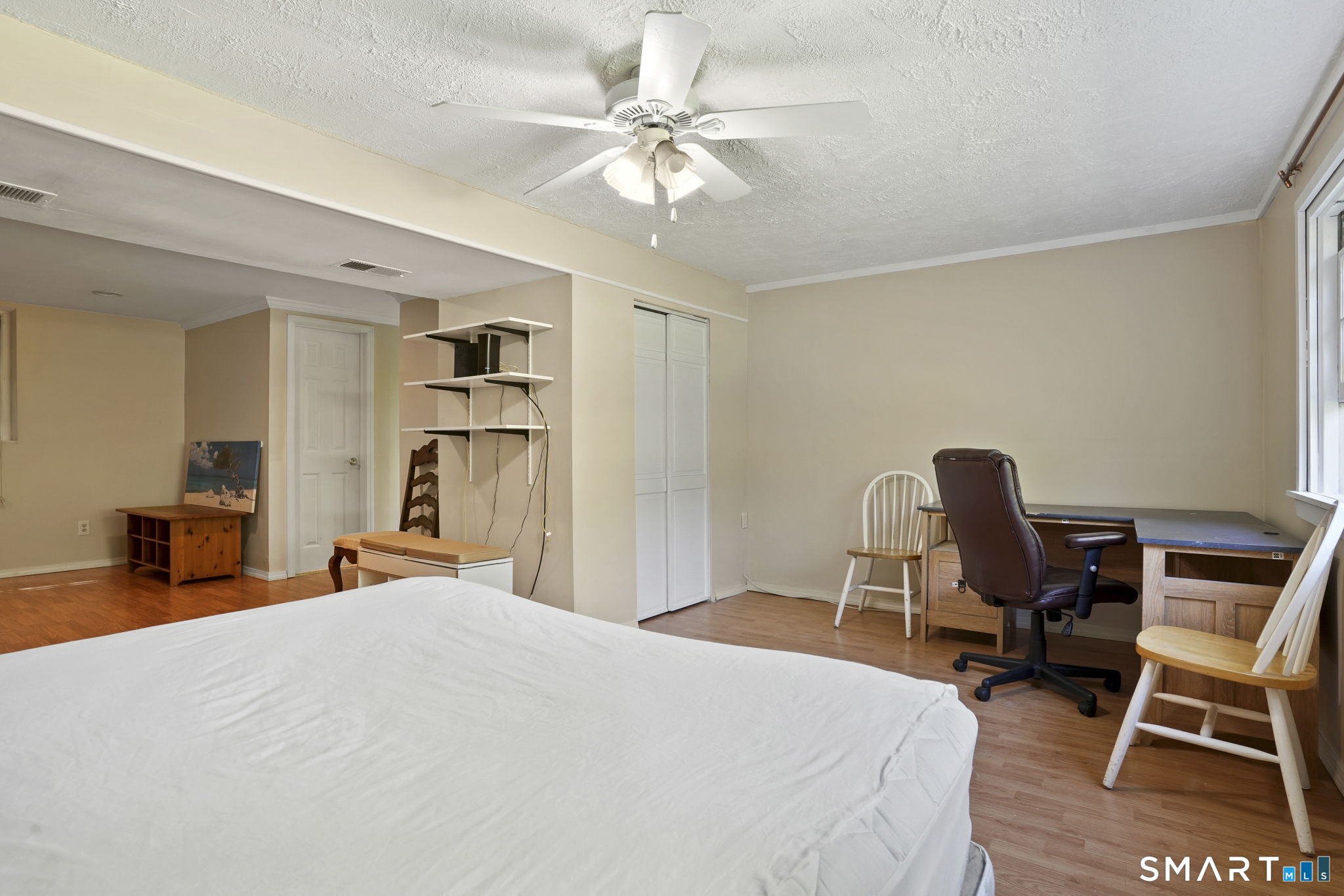 2 Laurel Hill Road South Sherman, CT 06784 - Photo 25 of 35 a bedroom with a bed and a chair in it