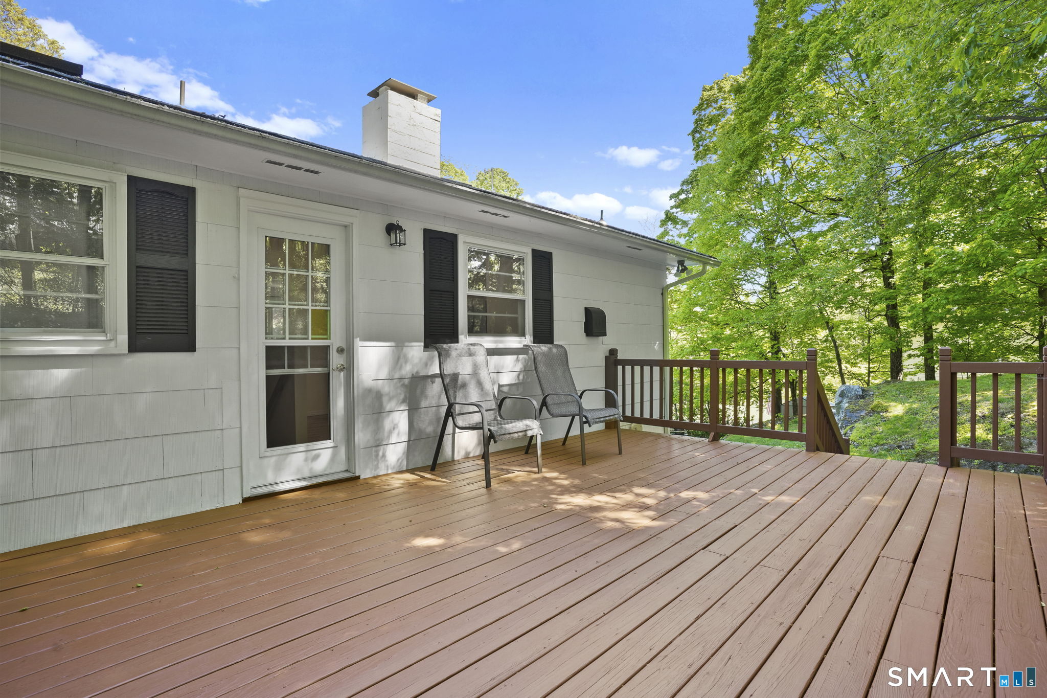 2 Laurel Hill Road South Sherman, CT 06784 - Photo 29 of 35 a view of a house with sitting area and wooden floor