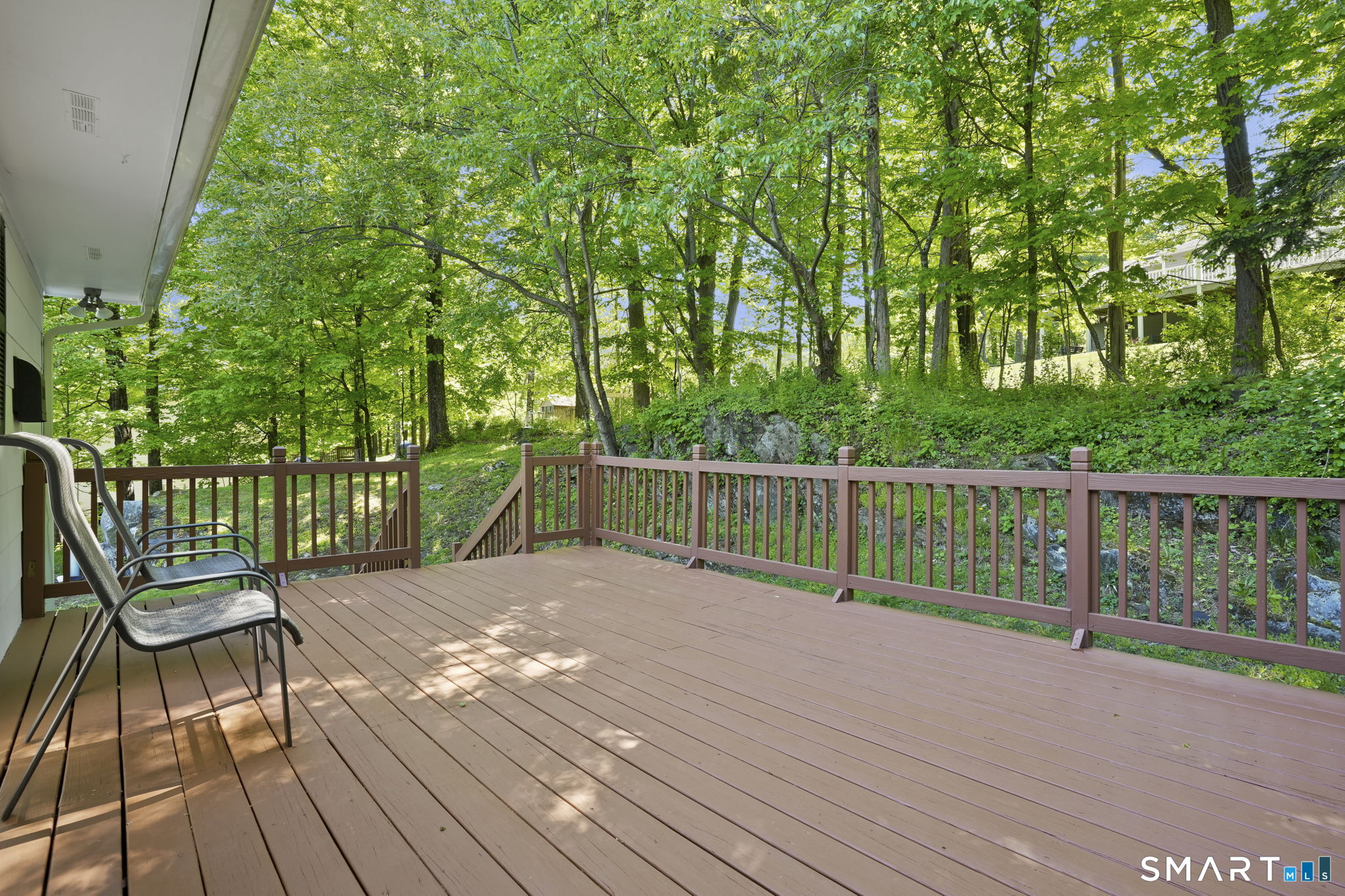 2 Laurel Hill Road South Sherman, CT 06784 - Photo 3 of 35 a view of a wooden deck with a big yard