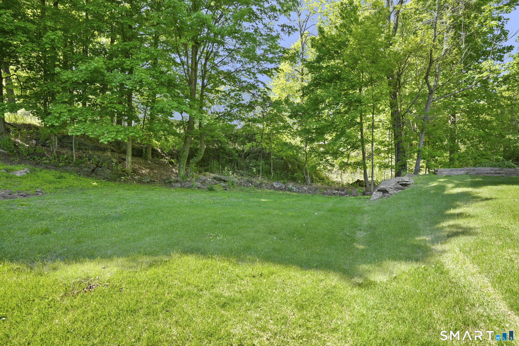 2 Laurel Hill Road South Sherman, CT 06784 - Photo 31 of 35 a view of a backyard with large trees