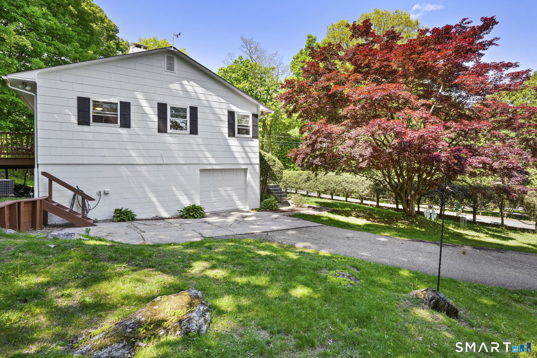 2 Laurel Hill Road South Sherman, CT 06784 - Photo 32 of 35 a view of a house with a patio and a yard