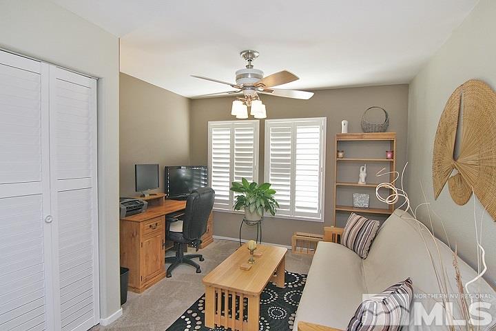 7724 Tulear Street Reno, NV 89506 - Photo 8 of 23 a workspace with furniture window and outside view