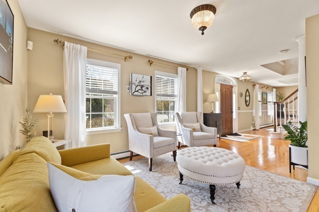 82 Hammersmith Drive Saugus, MA 01906 - Photo 12 of 41 a living room with furniture and a large window
