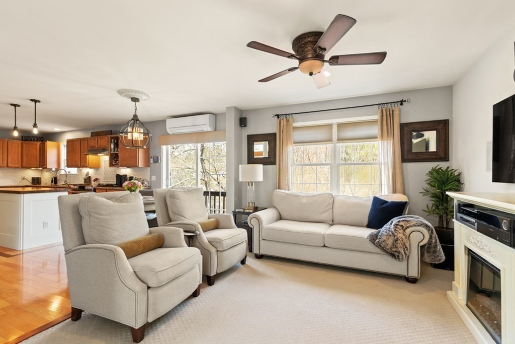 82 Hammersmith Drive Saugus, MA 01906 - Photo 14 of 41 a living room with furniture ceiling fan and a window