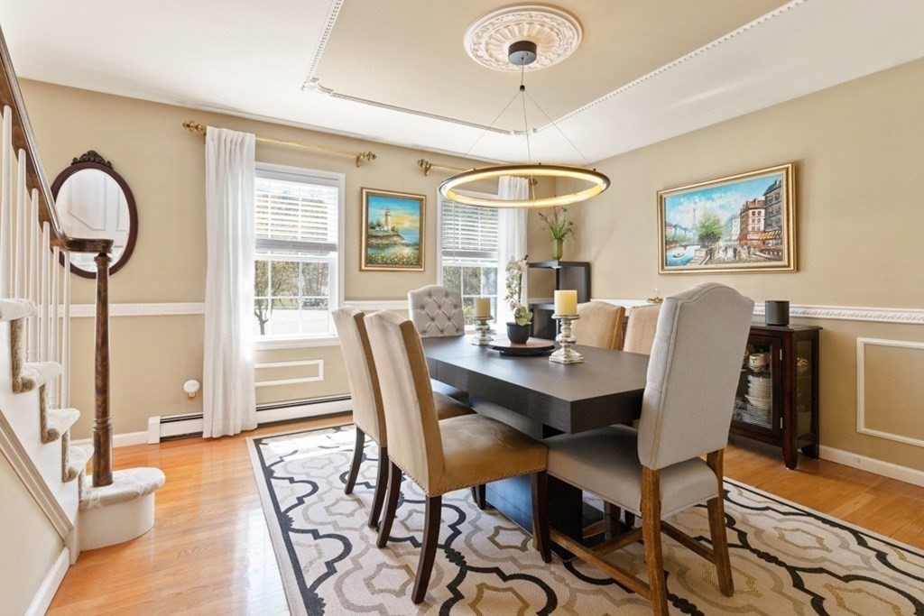 82 Hammersmith Drive Saugus, MA 01906 - Photo 16 of 41 a view of a dining room with furniture window and wooden floor