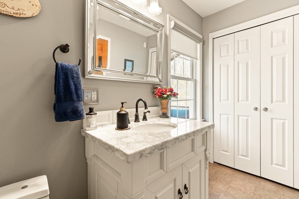 82 Hammersmith Drive Saugus, MA 01906 - Photo 26 of 41 a bathroom with a sink vanity and a mirror