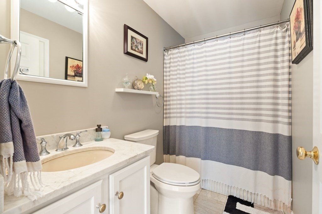 82 Hammersmith Drive Saugus, MA 01906 - Photo 27 of 41 a bathroom with a sink toilet and shower