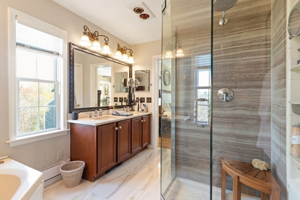 82 Hammersmith Drive Saugus, MA 01906 - Photo 29 of 41 a bathroom with a double vanity sink and a mirror