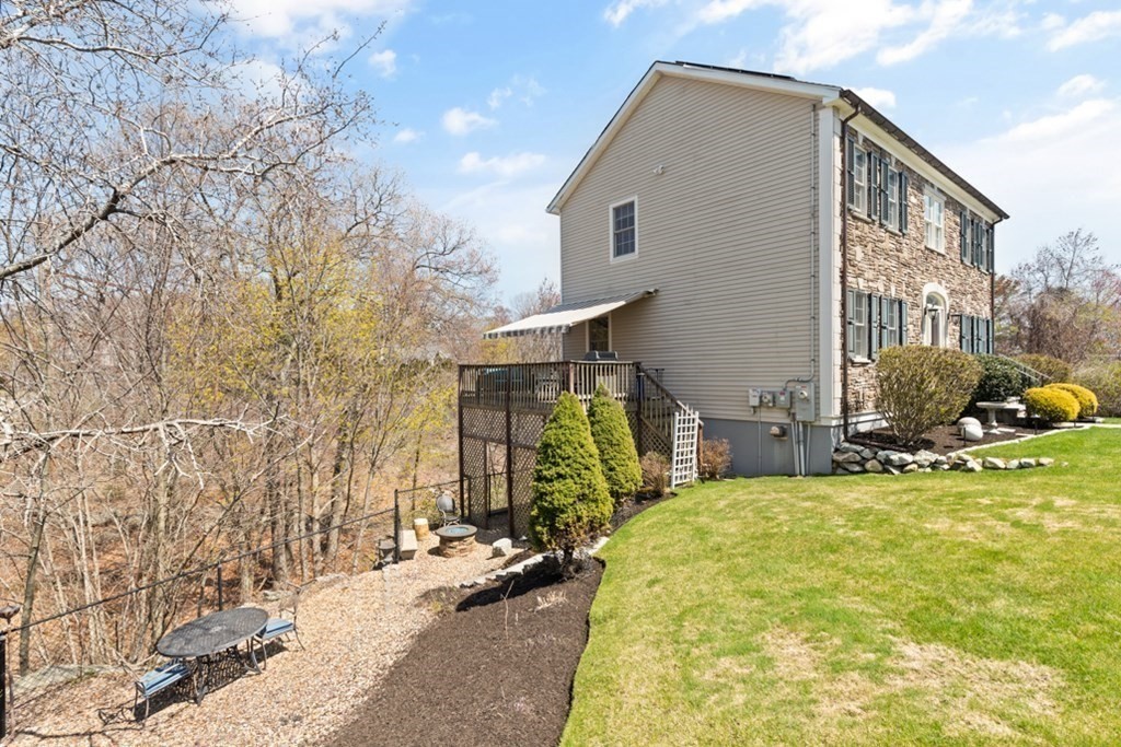 82 Hammersmith Drive Saugus, MA 01906 - Photo 32 of 41 a view of a house with yard and sitting area
