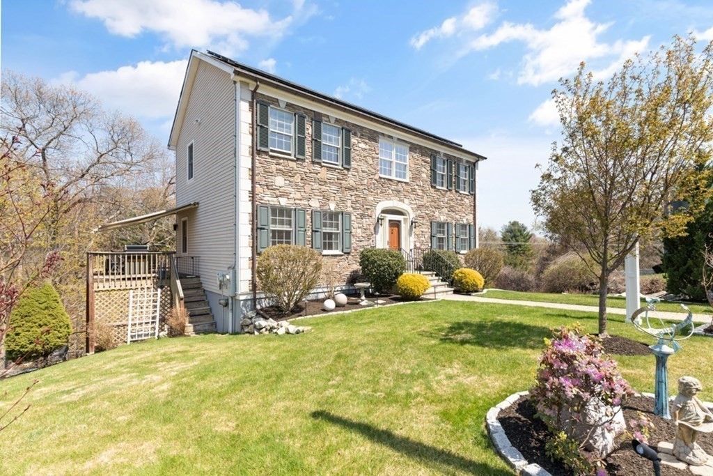 82 Hammersmith Drive Saugus, MA 01906 - Photo 5 of 41 a view of a house with backyard and sitting area
