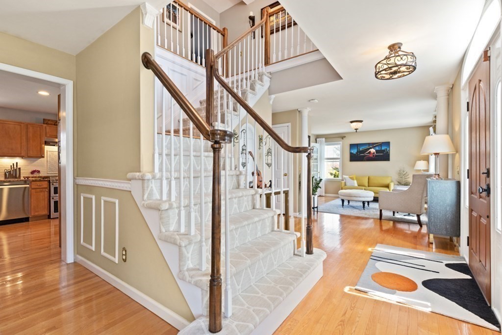 82 Hammersmith Drive Saugus, MA 01906 - Photo 9 of 41 a view of entryway and hall with wooden floor