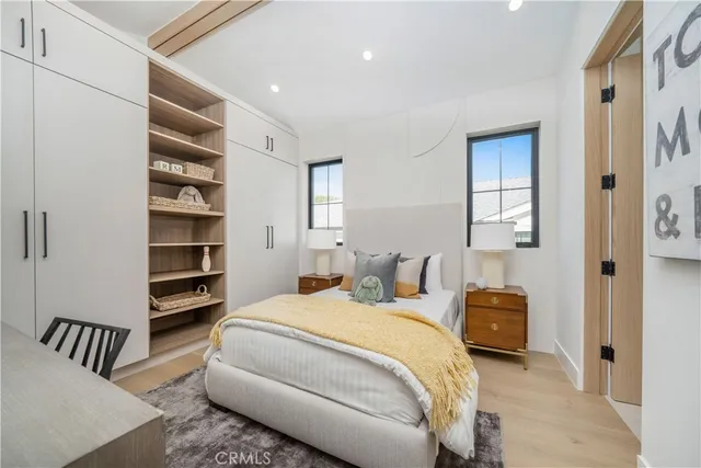 a bedroom with a bed and a closet