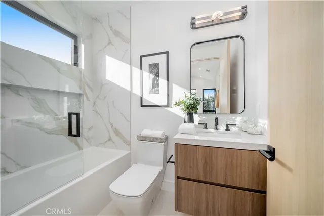 a bathroom with a toilet a sink and a bathtub