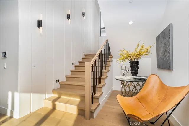 a view of entryway with wooden floor and a potted plant