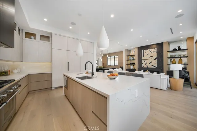 a large kitchen with stainless steel appliances lots of counter top space