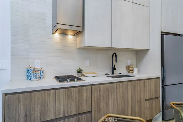 a kitchen with a sink and cabinets