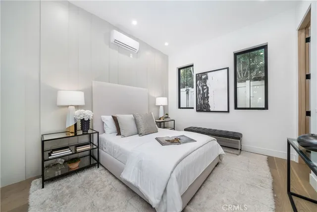 a bedroom with bed and window