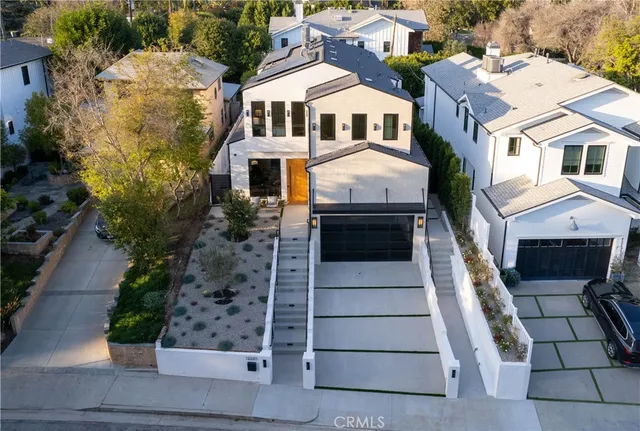 a aerial view of a house with a lake view