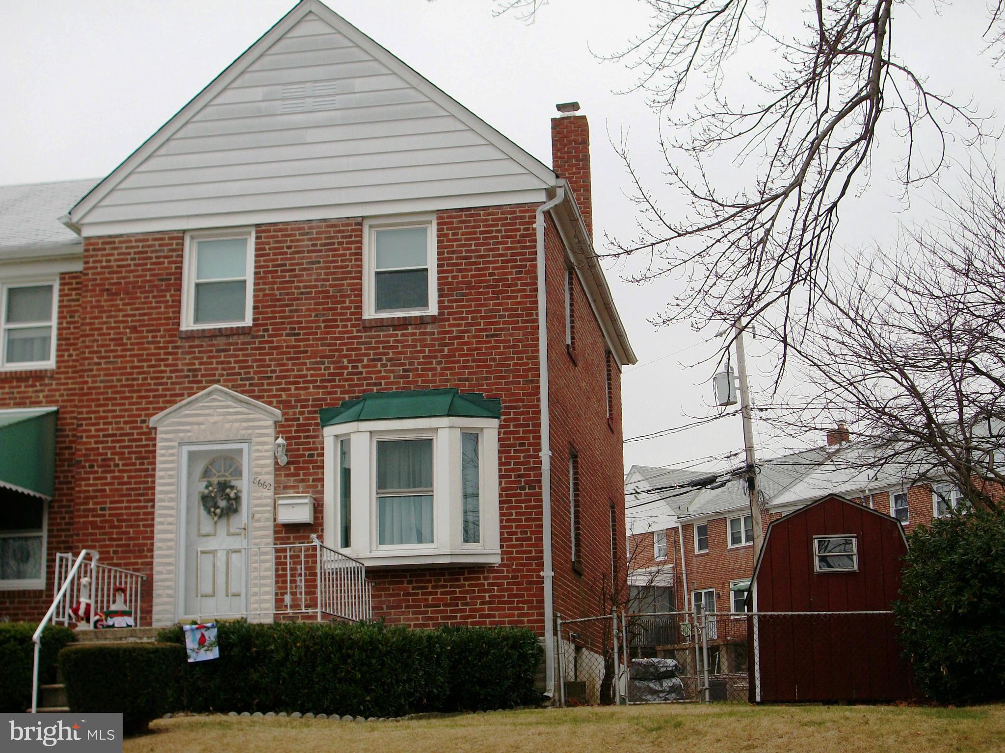 8662 Black Oak Road Baltimore, MD 21234 - Photo 1 of 30 a front view of a house with a yard