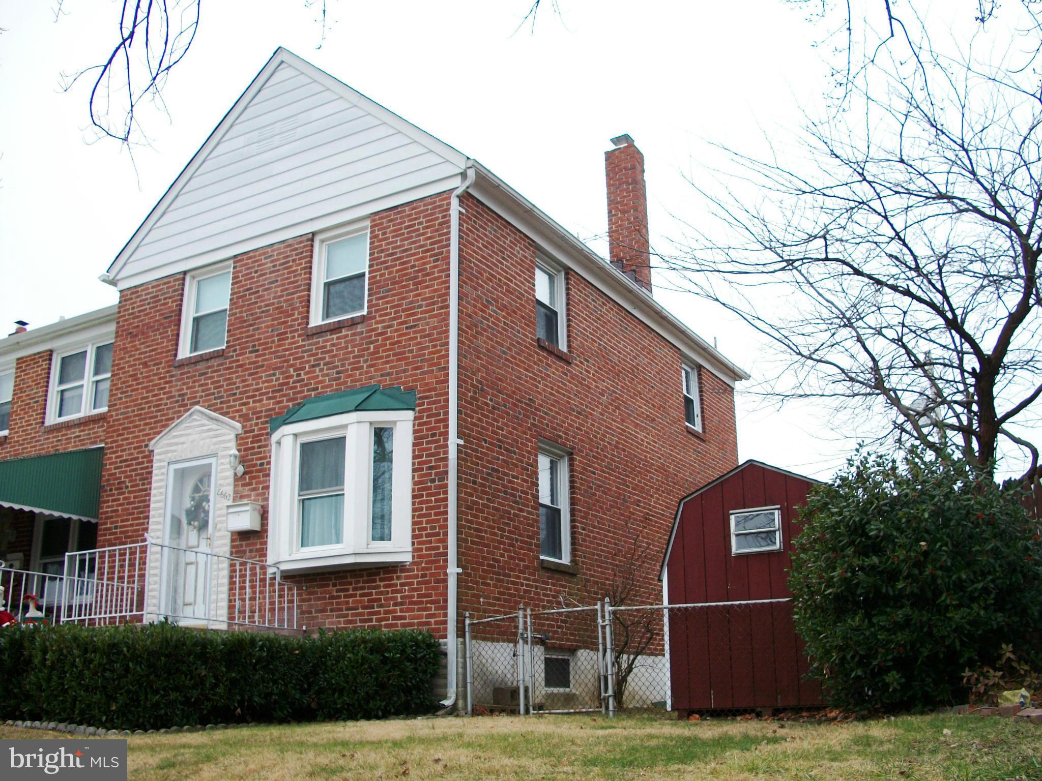 8662 Black Oak Road Baltimore, MD 21234 - Photo 2 of 30 a front view of a house with a yard