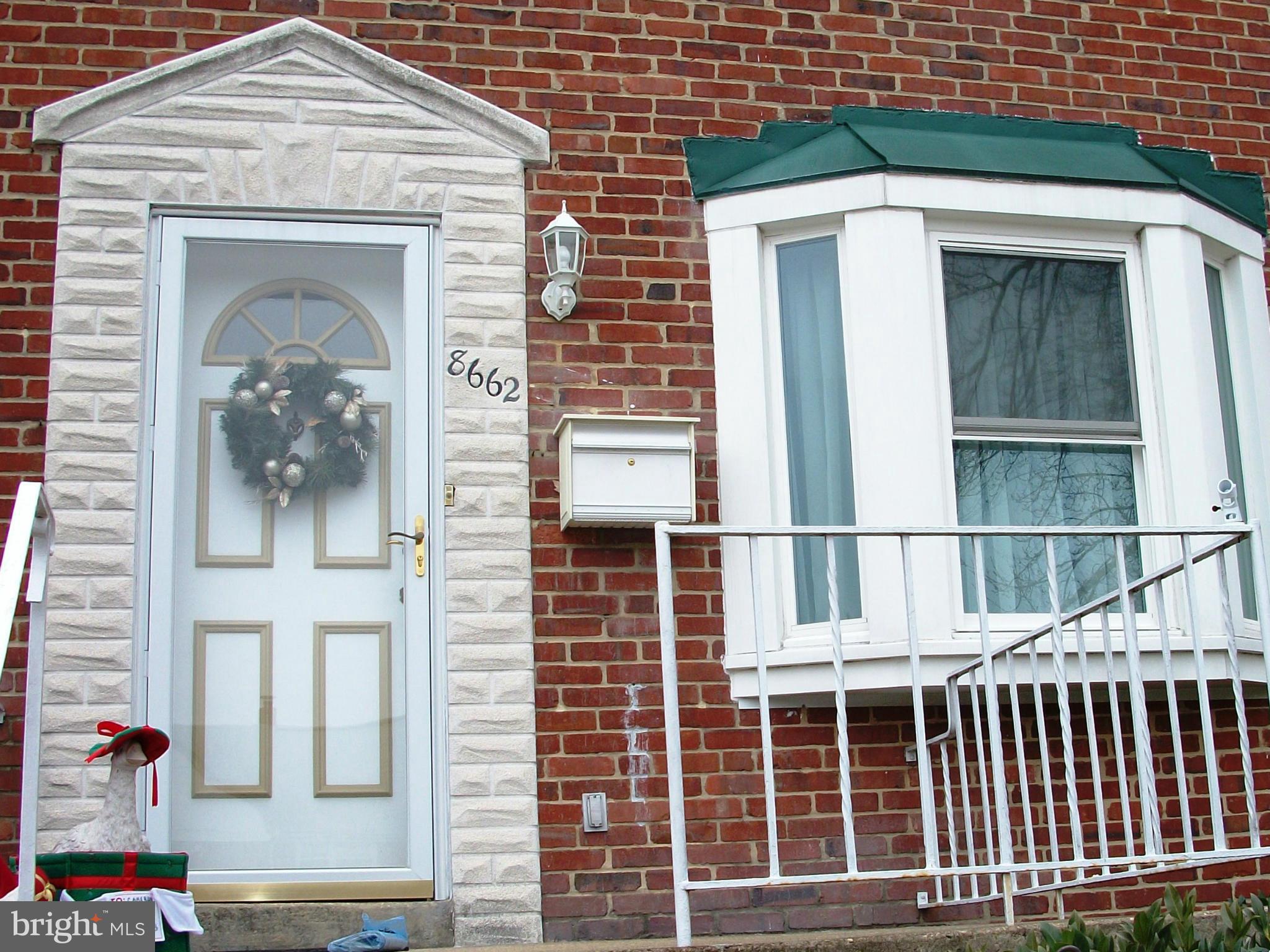 8662 Black Oak Road Baltimore, MD 21234 - Photo 3 of 30 a front view of a house with glass windows