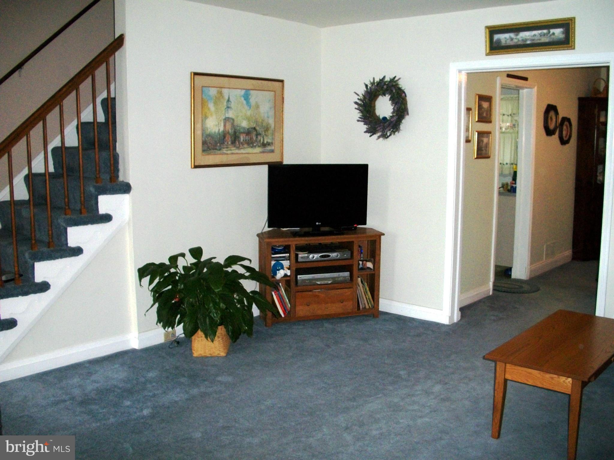 8662 Black Oak Road Baltimore, MD 21234 - Photo 6 of 30 a view of a livingroom with furniture and a flat screen tv