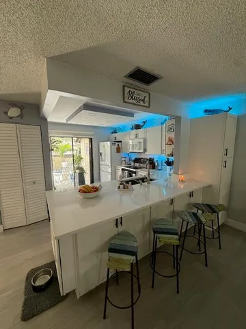 a room with furniture a window and gym equipment