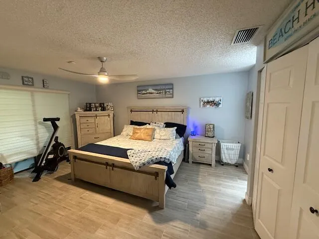 a bed room with a bed window and a television