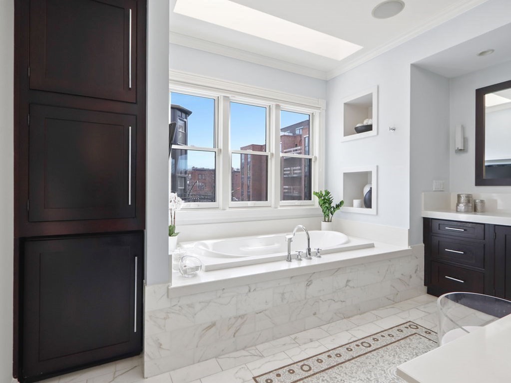 138 St Botolph Street Boston, MA 02115 - Photo 15 of 39 a spacious bathroom with a bathtub and a sink