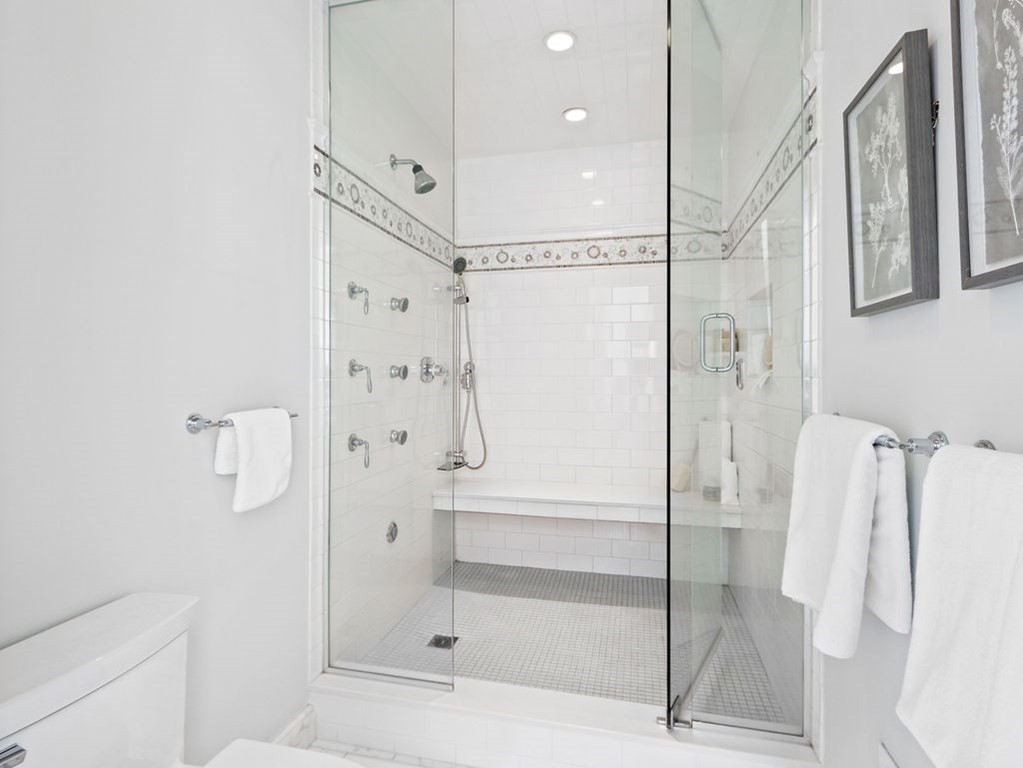 138 St Botolph Street Boston, MA 02115 - Photo 17 of 39 a bathroom with a shower and a glass door