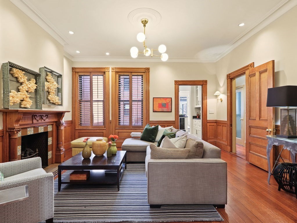 138 St Botolph Street Boston, MA 02115 - Photo 2 of 39 a living room with furniture fireplace and a large window