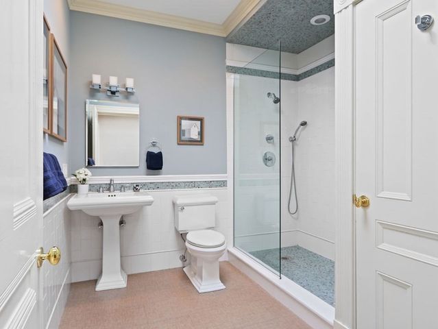a bathroom with a sink toilet and shower