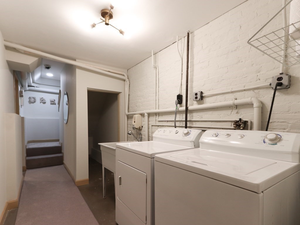 138 St Botolph Street Boston, MA 02115 - Photo 36 of 39 a utility room with dryer and washer