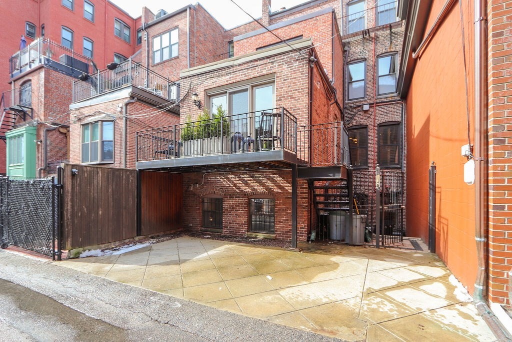 138 St Botolph Street Boston, MA 02115 - Photo 38 of 39 a view of a building with a door and a garage