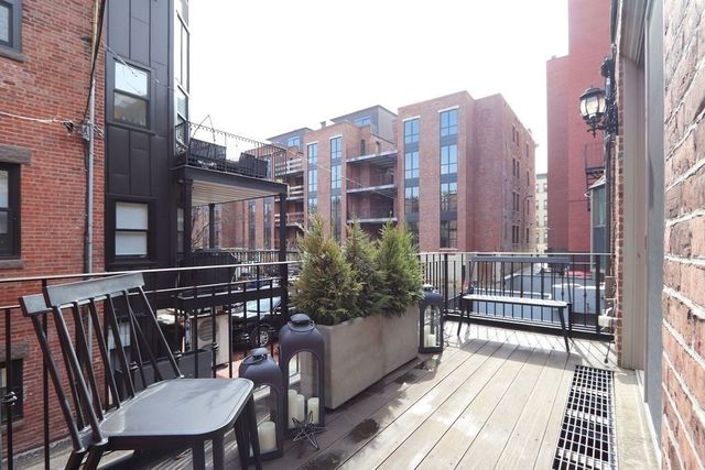 a view of a balcony with furniture