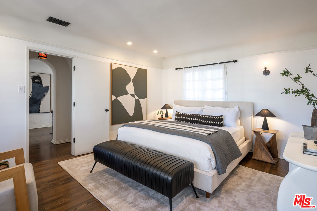8420 Cresthill Road Los Angeles, CA 90069 - Photo 13 of 30 a bedroom with bed and window