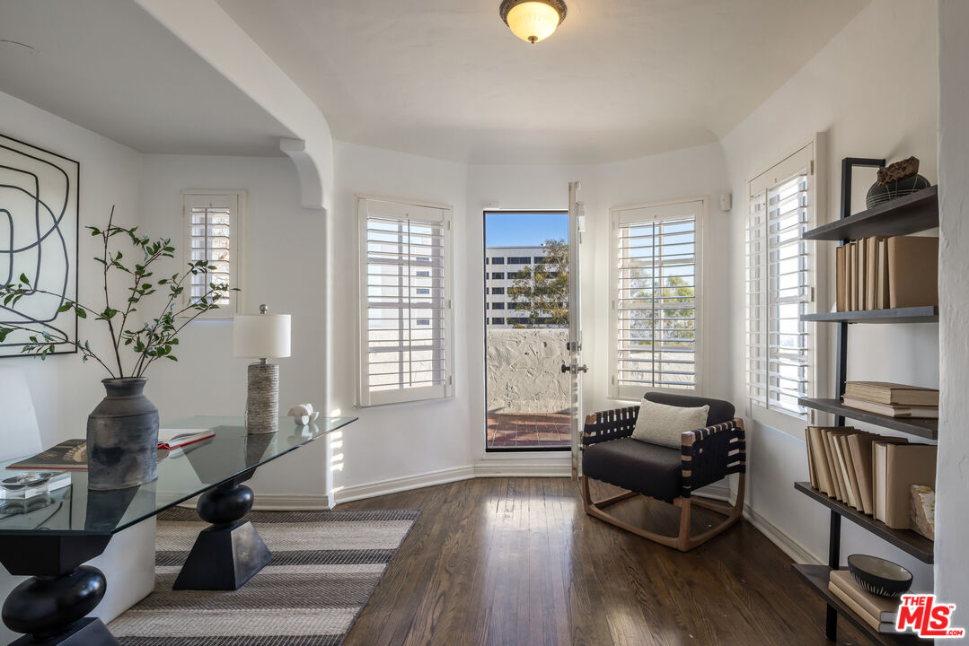 8420 Cresthill Road Los Angeles, CA 90069 - Photo 16 of 30 a living room with furniture a window and wooden floor
