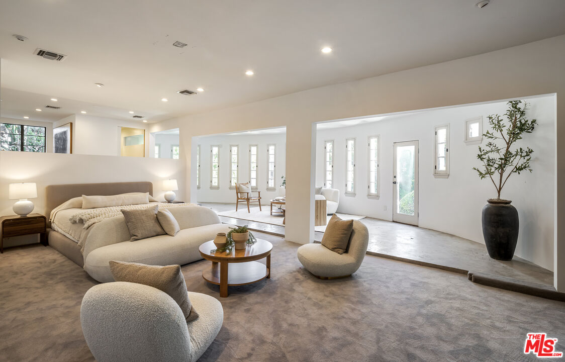 8420 Cresthill Road Los Angeles, CA 90069 - Photo 17 of 30 a living room with furniture and a potted plant